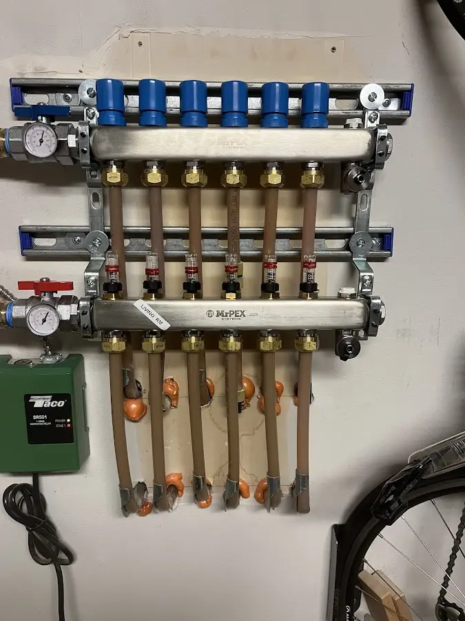 Plumber performing Water Heater Repair at a residential property in Rural Hall